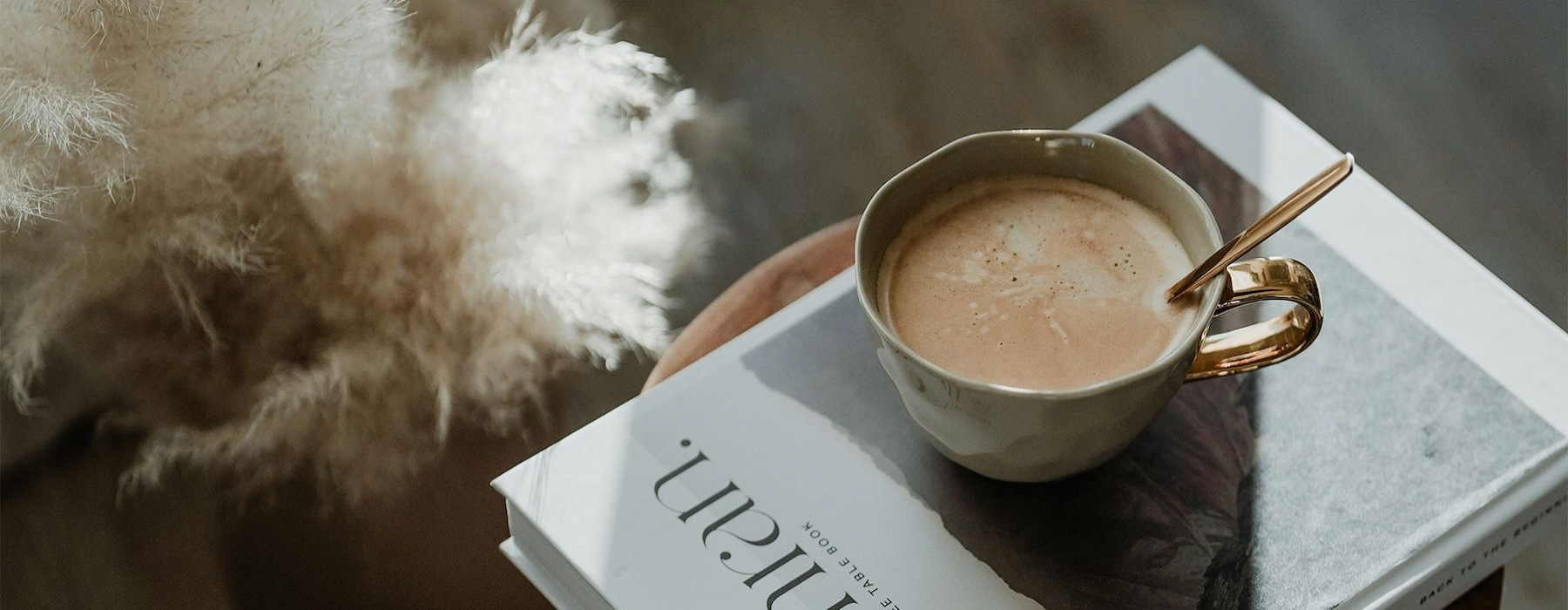 a cup of coffee on a book