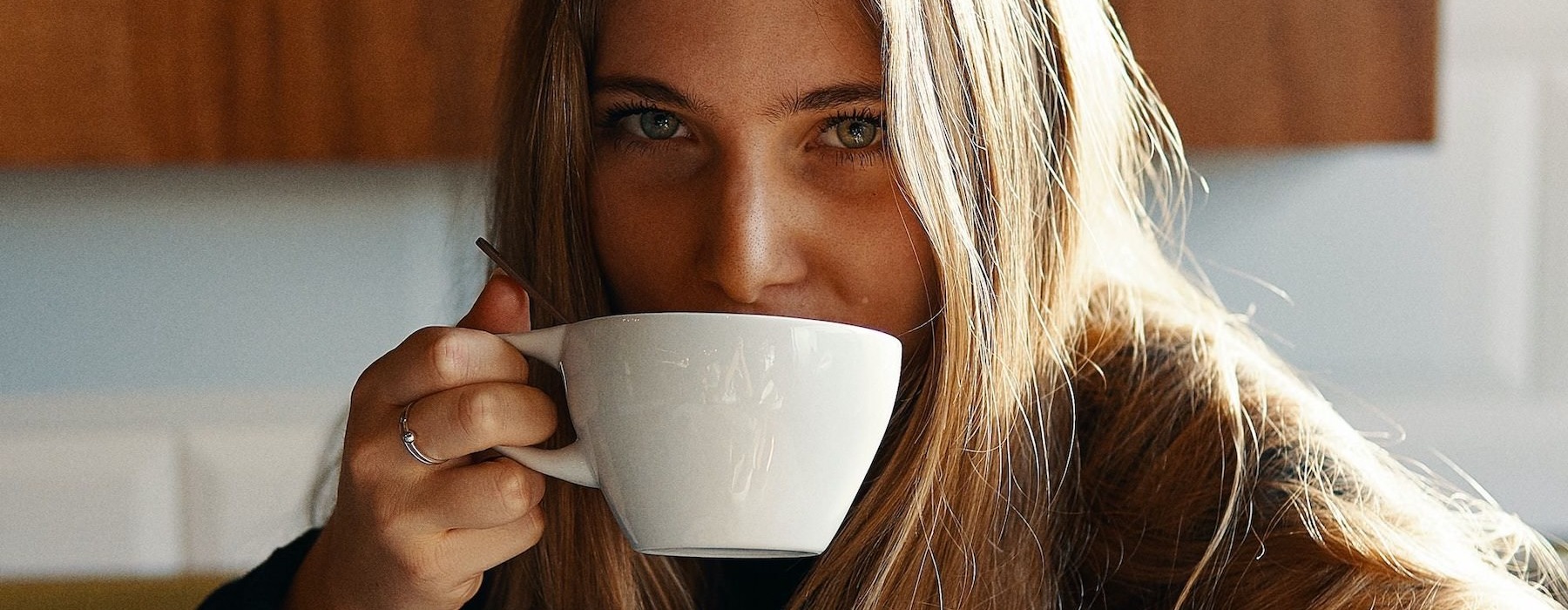 a person drinking from a cup
